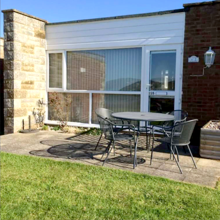 Holiday Home on the Isle of Wight. The Beach Hut and front patio that looks out over the Solent to The Needles